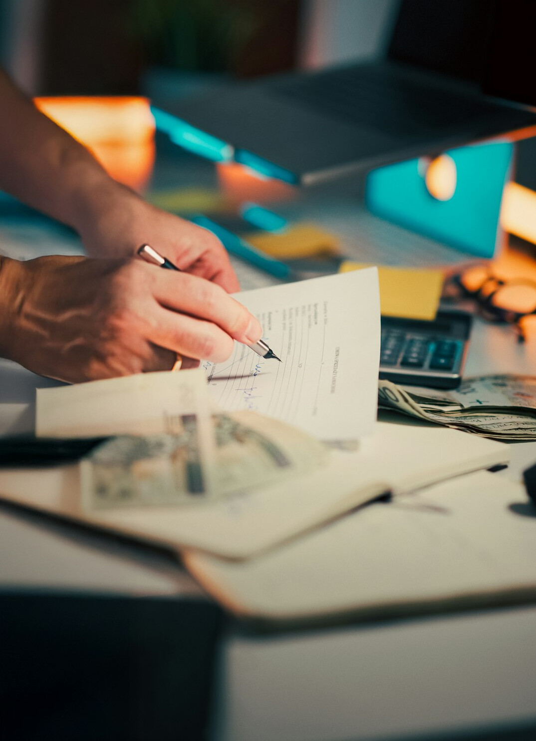 person calculating monthly expenses