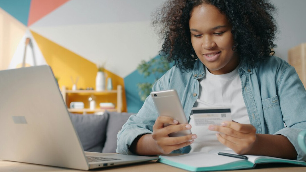 woman tracking expenses on laptop