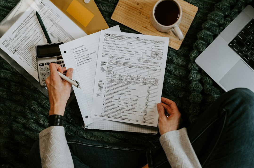 woman writing financial goals